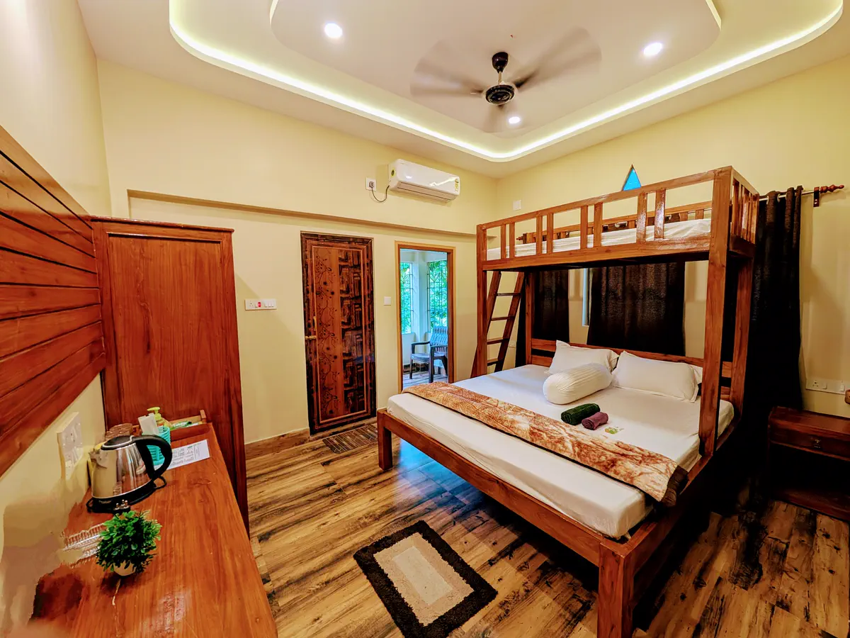 Super deluxe room with wooden double bed and loft